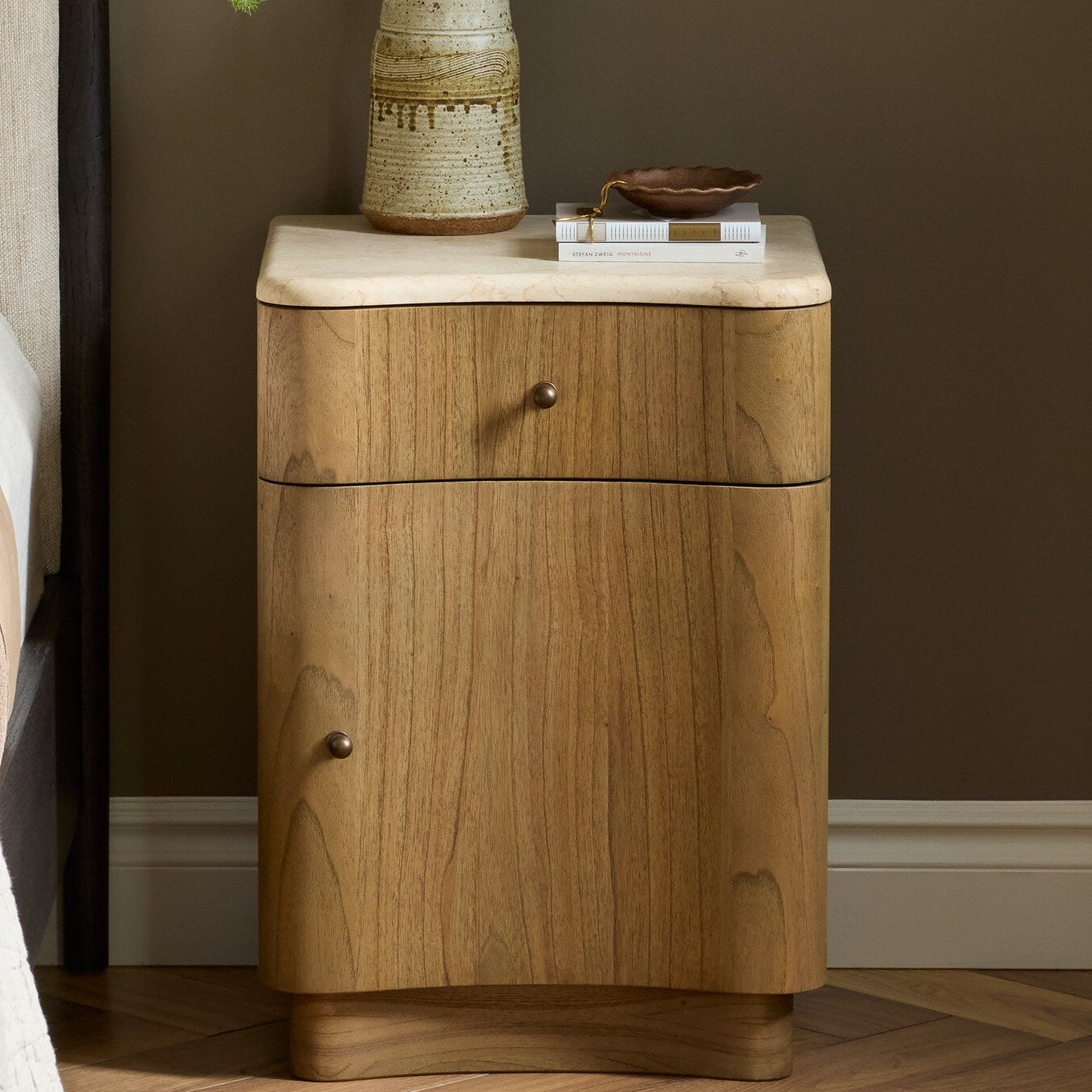 Four Hands Boa Cream Marble Small Nightstand styled in a room setting
