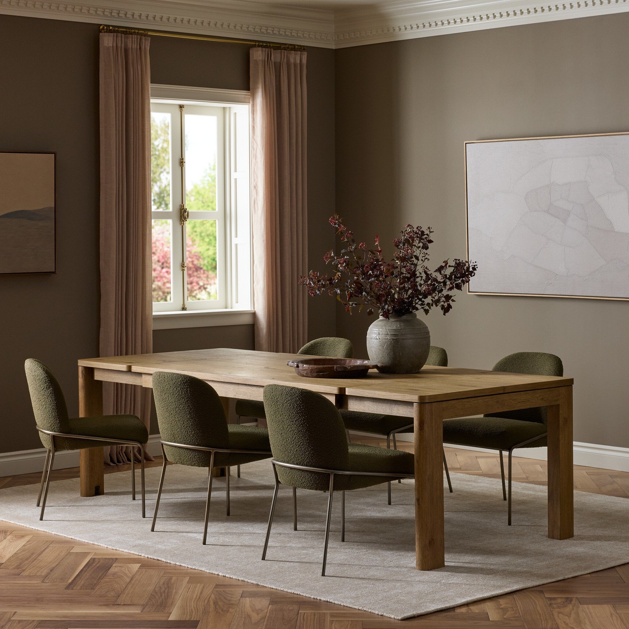Four Hands Noeline Worn Oak Extension Dining Table shown in a styled interior