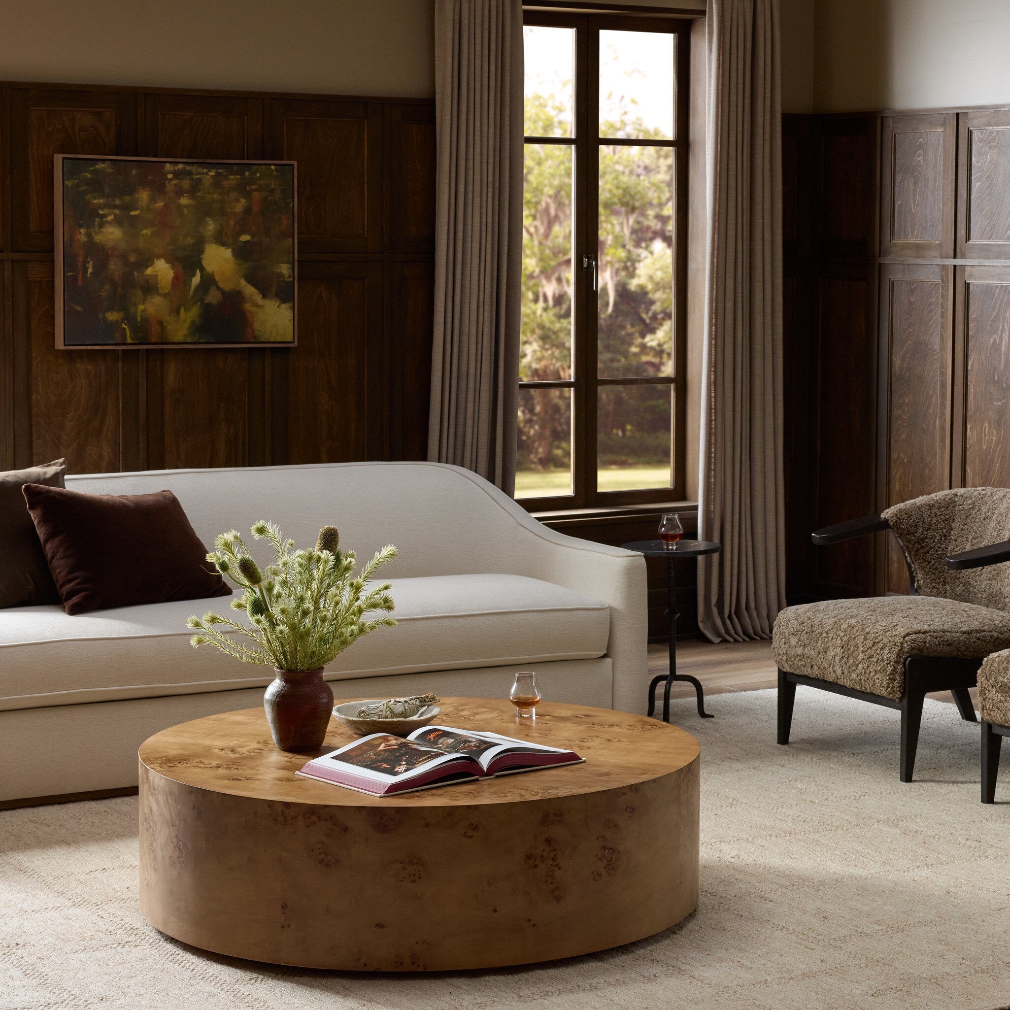 Four Hands Caya Caramel Burl Large Coffee Table styled in a room setting