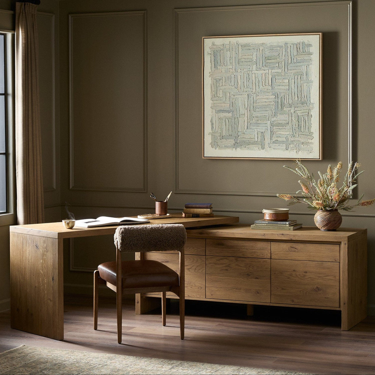 Four Hands Noah Aged Smoked Oak Resawn Rotating Desk - styled room setting