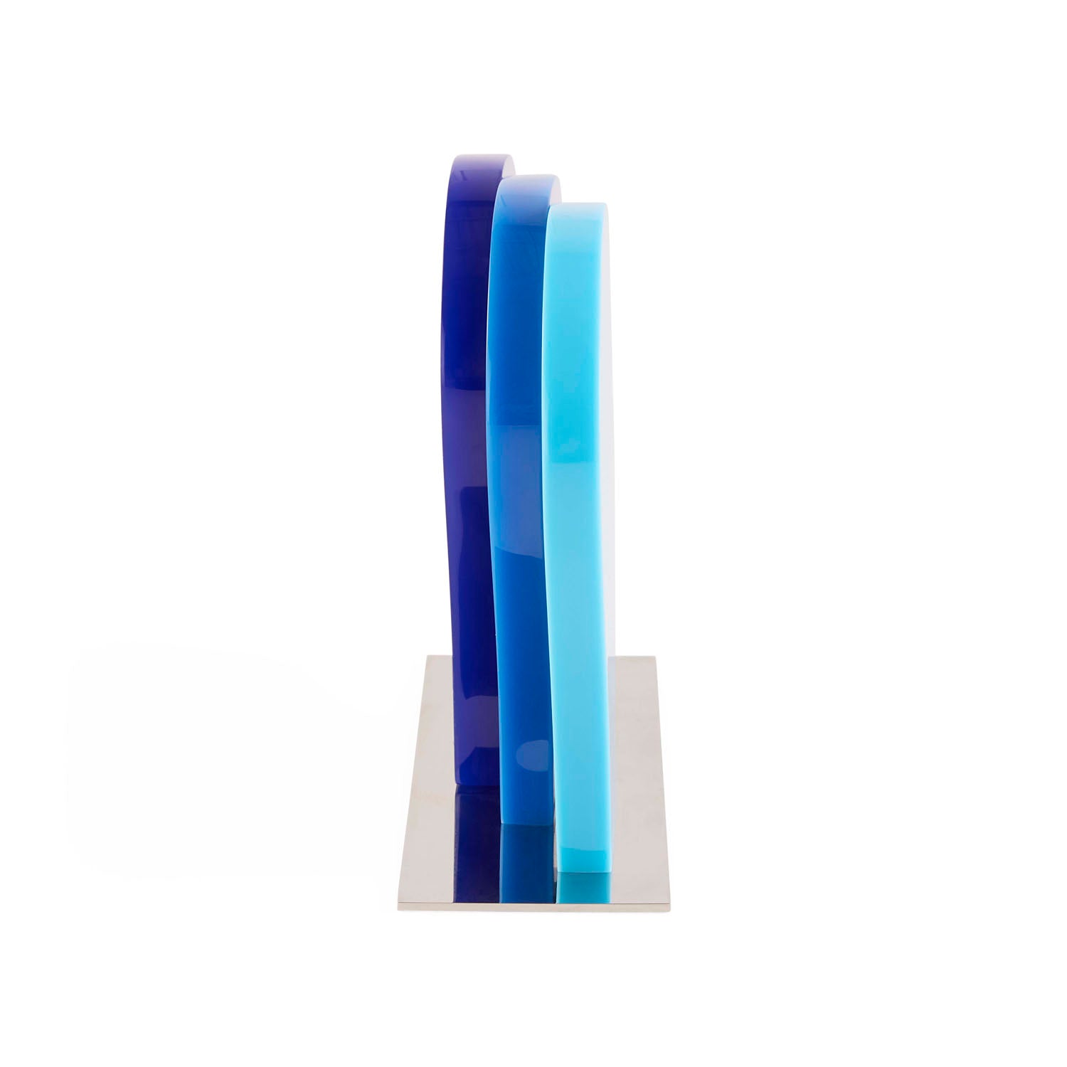 Jonathan Adler Atlas Objet in layered multi-blue acrylic on a nickel base shown to scale in a styled setting
