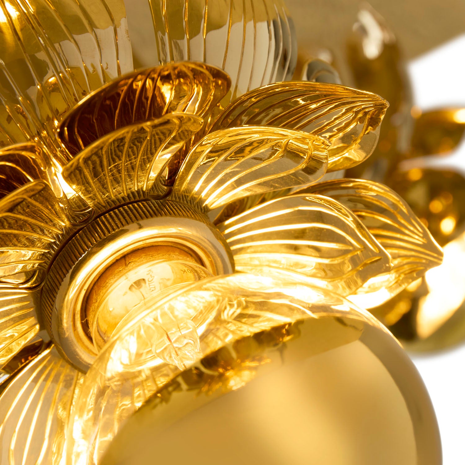 Side profile of Jonathan Adler Brass Flower Pendant in solid polished brass