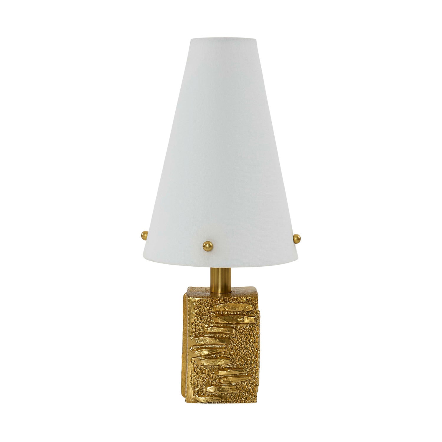 Jonathan Adler Foundry brass lamp illuminated on a bar cart