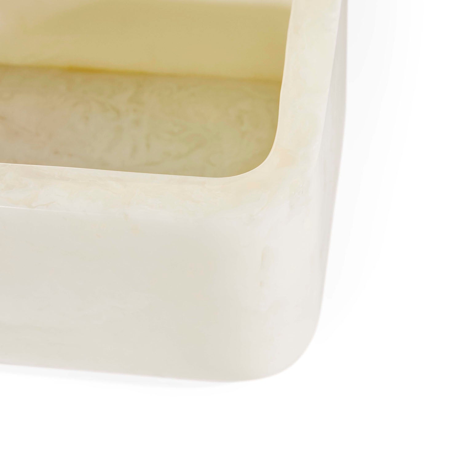 Jonathan Adler Fontana Box in white marbleized acrylic with brass handles shown to scale in a styled setting