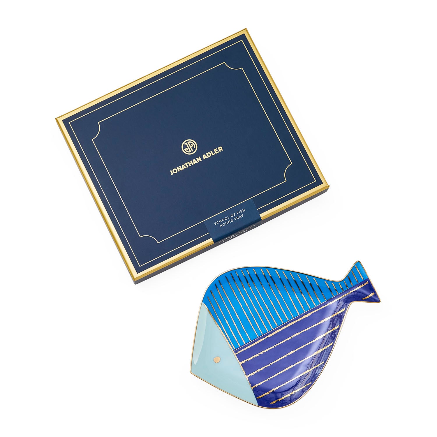 Jonathan Adler The School of Fish round tray in blue and gold porcelain styled in a room