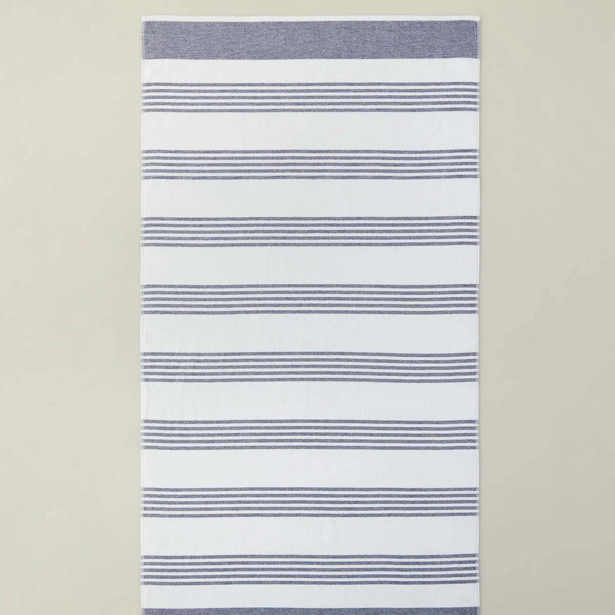Peacock Alley Aegean Stripe Beach Towel Turkish cotton, shown in the navy colorway