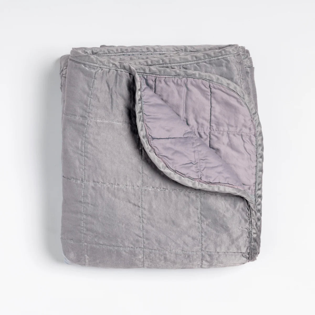 Bella Notte Sel Throw Blanket in quilted charmeuse, shown in a cool, soft tone