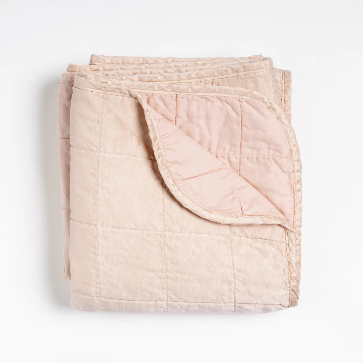 Bella Notte Sel Throw Blanket in quilted charmeuse, highlighting the quilted charmeuse drape and movement