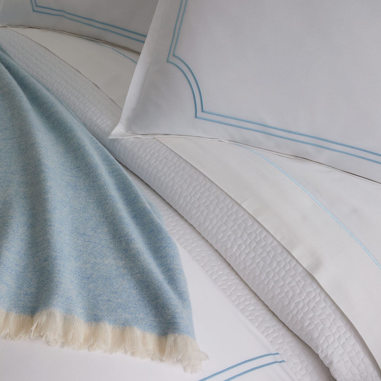 Peacock Alley Deco embroidered cotton percale duvet set draped and layered detail