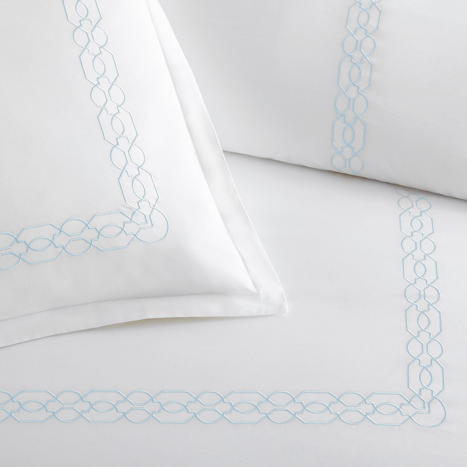 Peacock Alley Filigree embroidered cotton percale duvet set draped and layered detail