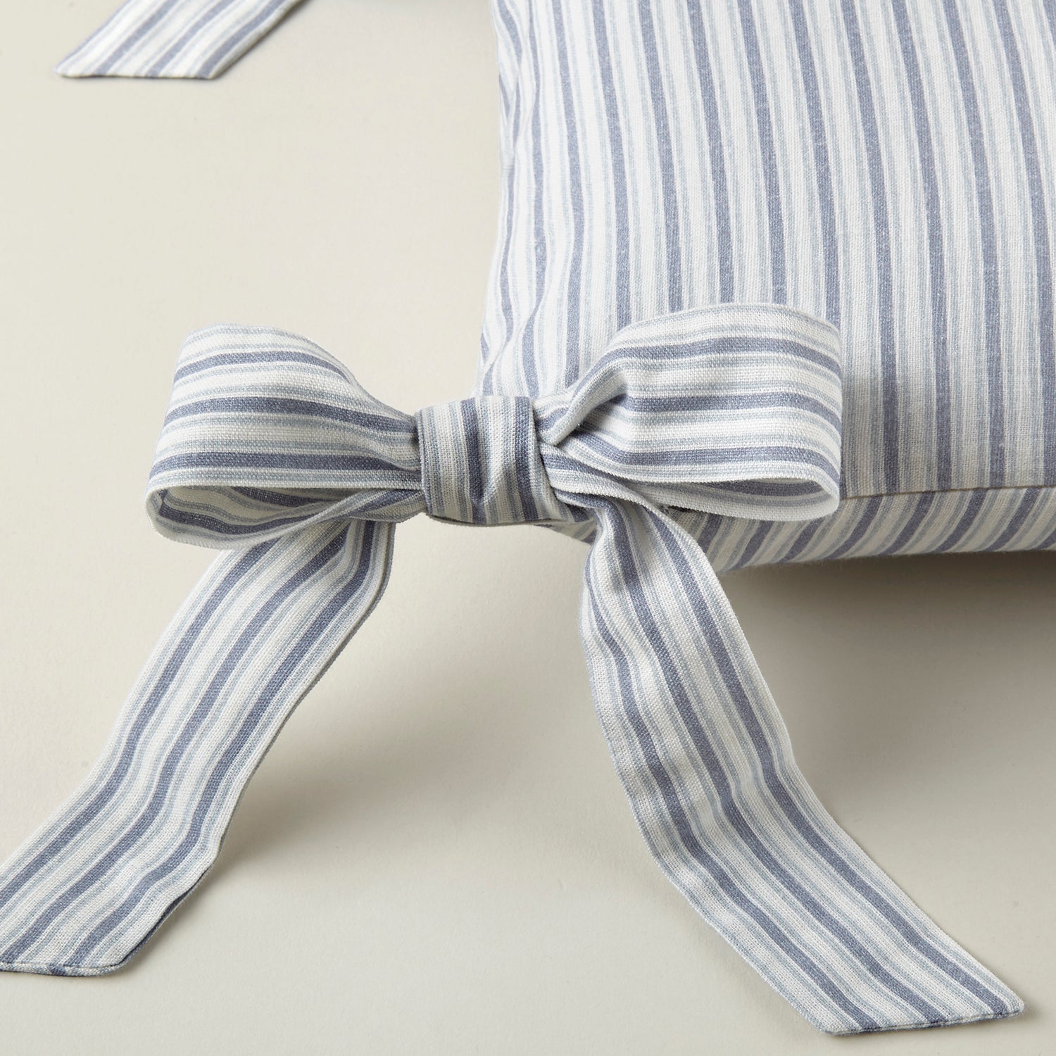 Caitlin Oblong Bow Pillow cotton flame accent pillow, shown in a deeper colorway