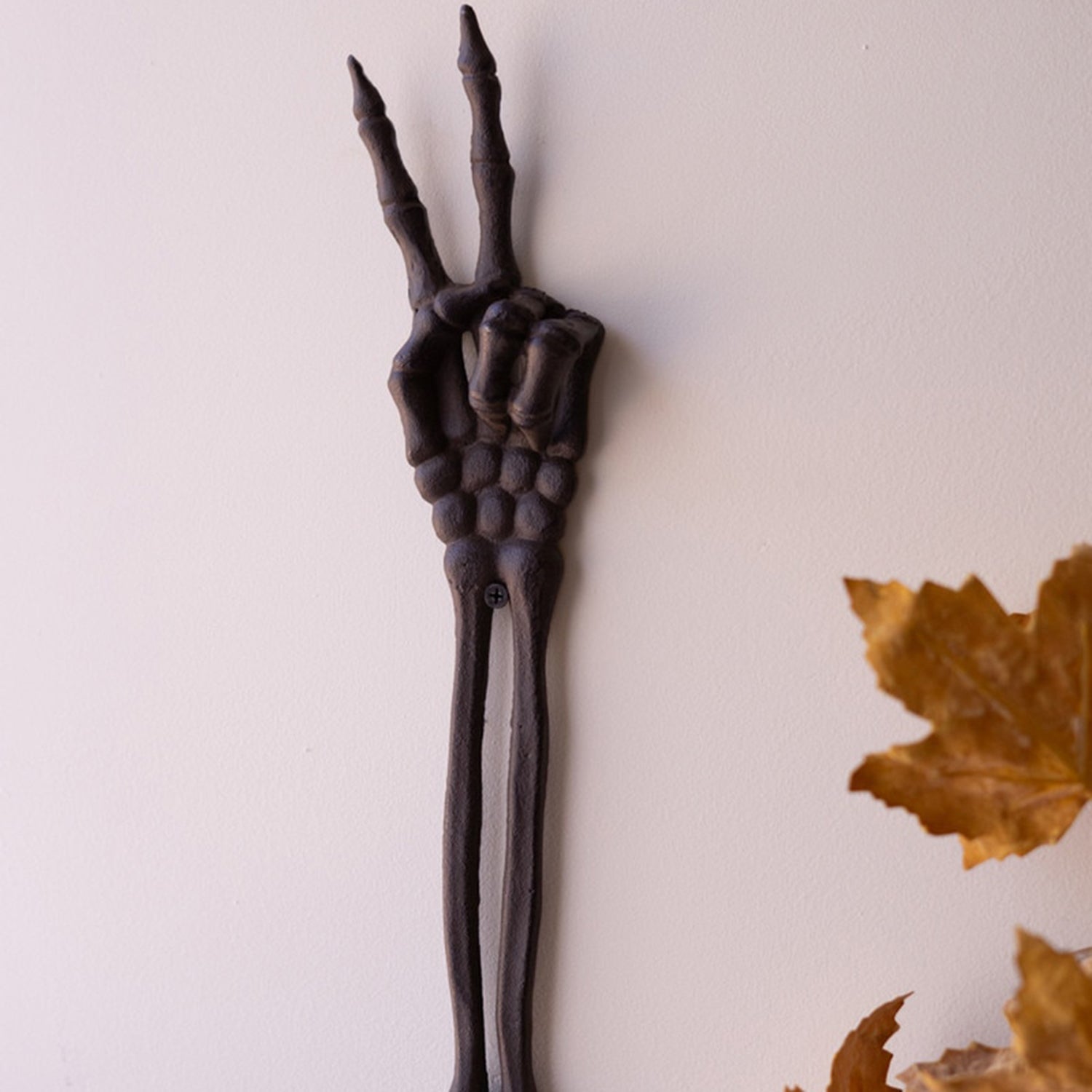 Cast Iron Skeleton Peace Arm