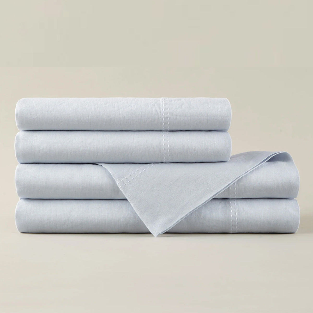 Peacock Alley European washed linen sheet set stack of neatly folded linens