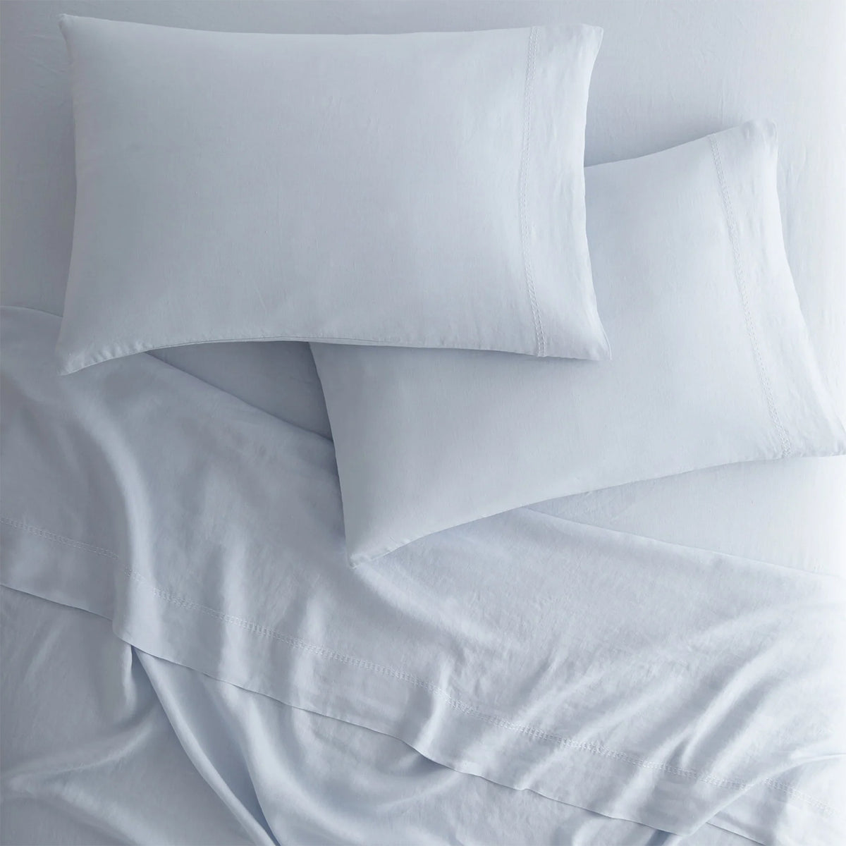 Peacock Alley European washed linen sheet set draped and layered detail