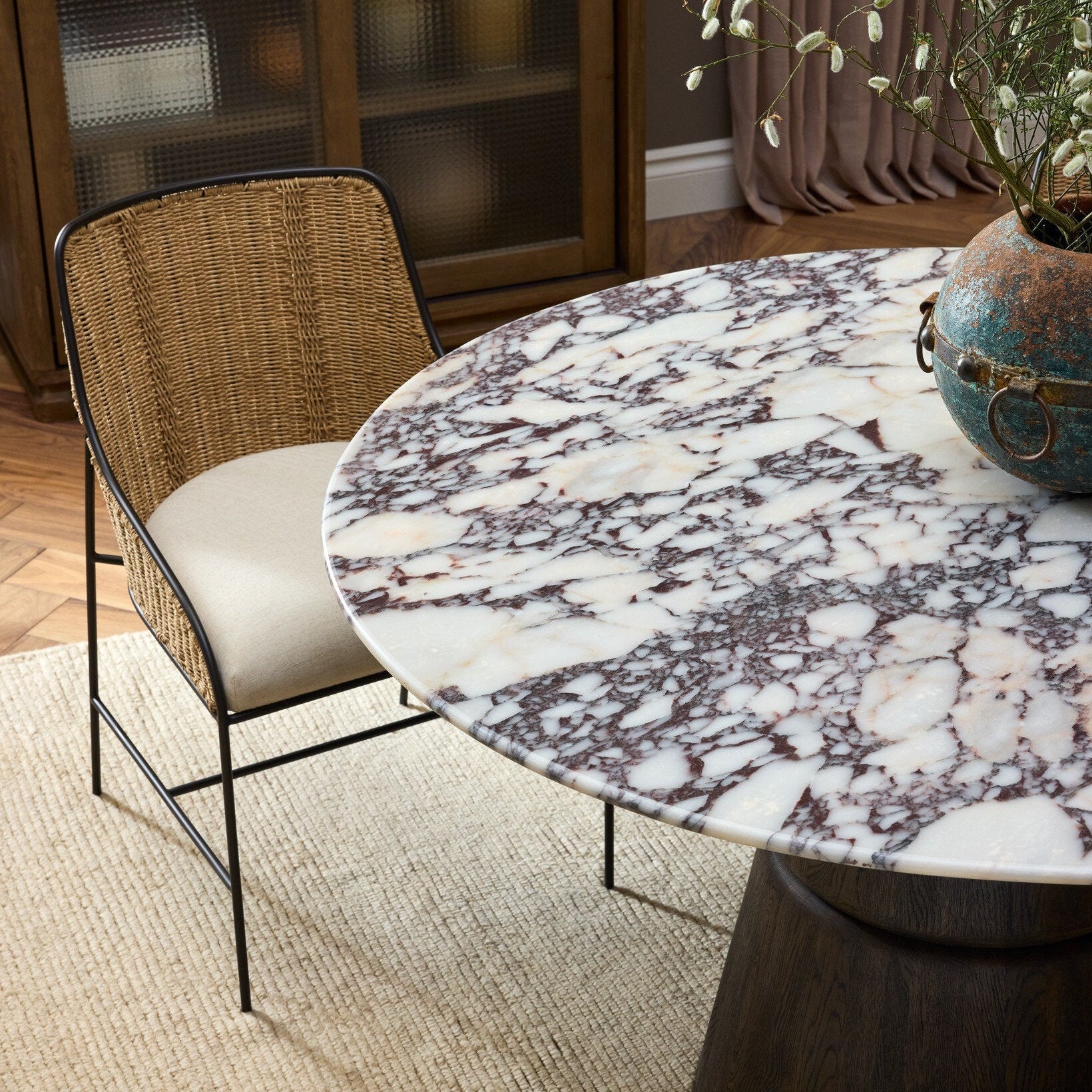 Four Hands Lino Calacatta Viola Marble Dining Table styled in a room setting (2)