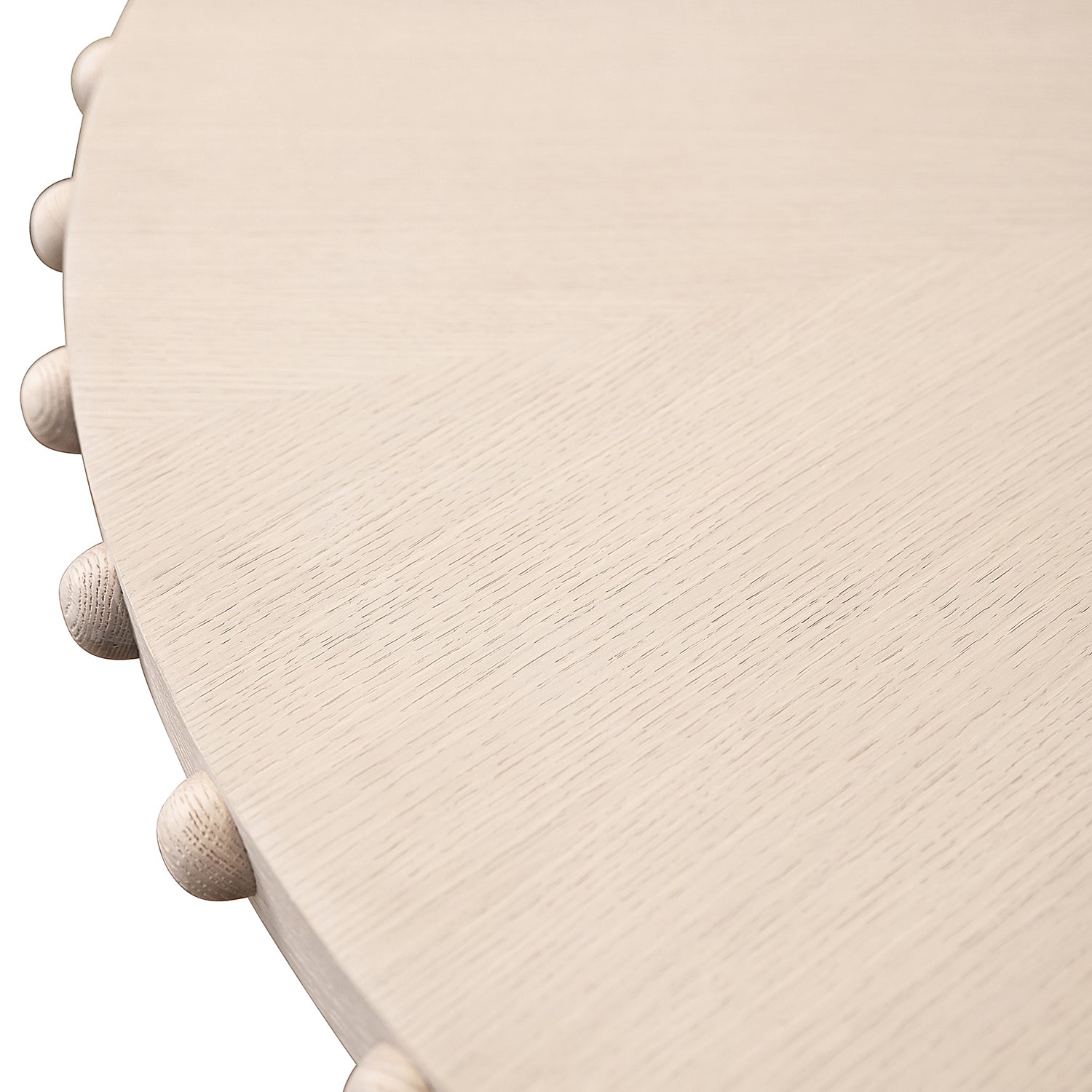 Close-up of the white oak wood finish on the Lucian White Oak Round Dining Table
