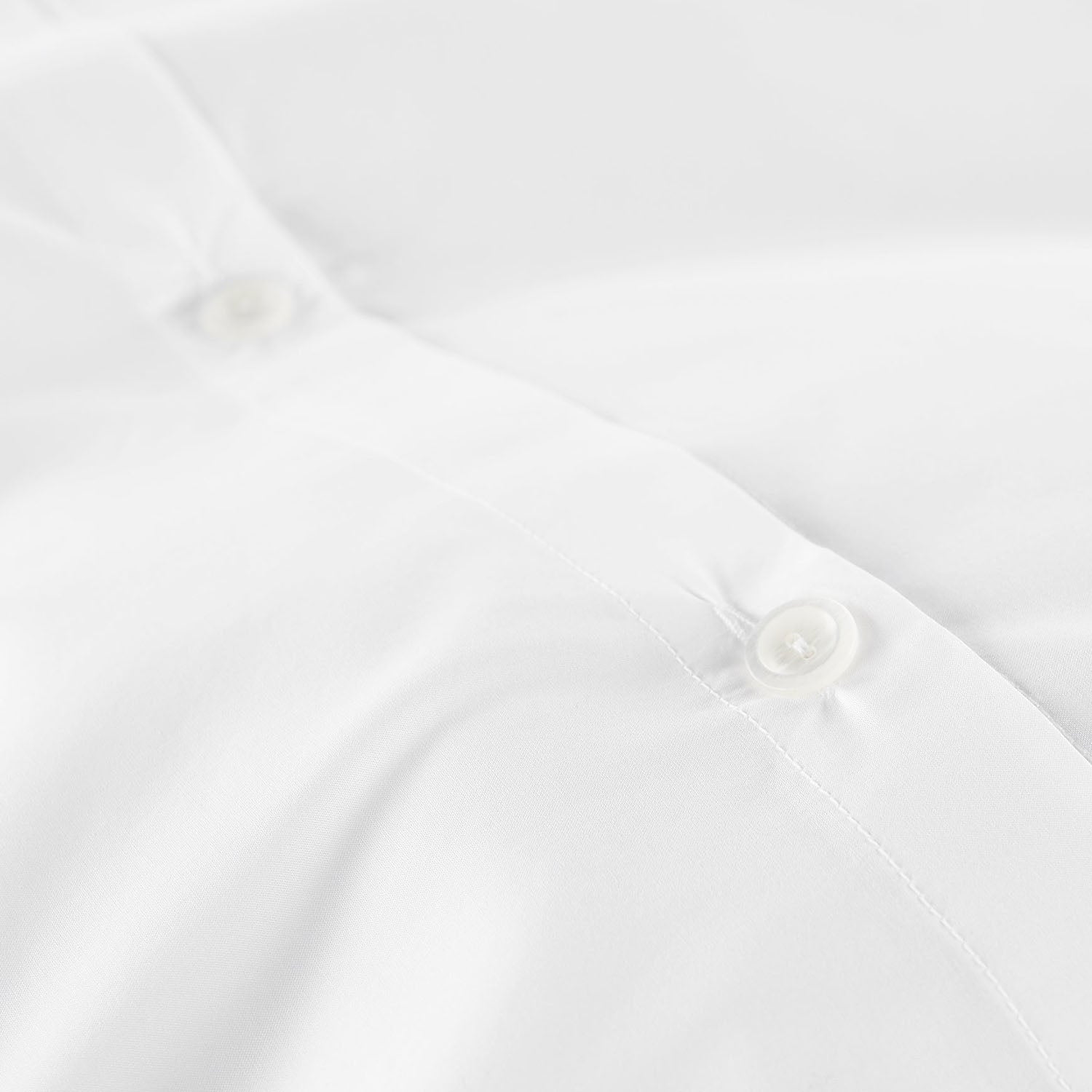 Peacock Alley Lyric percale cotton duvet cover draped and layered detail