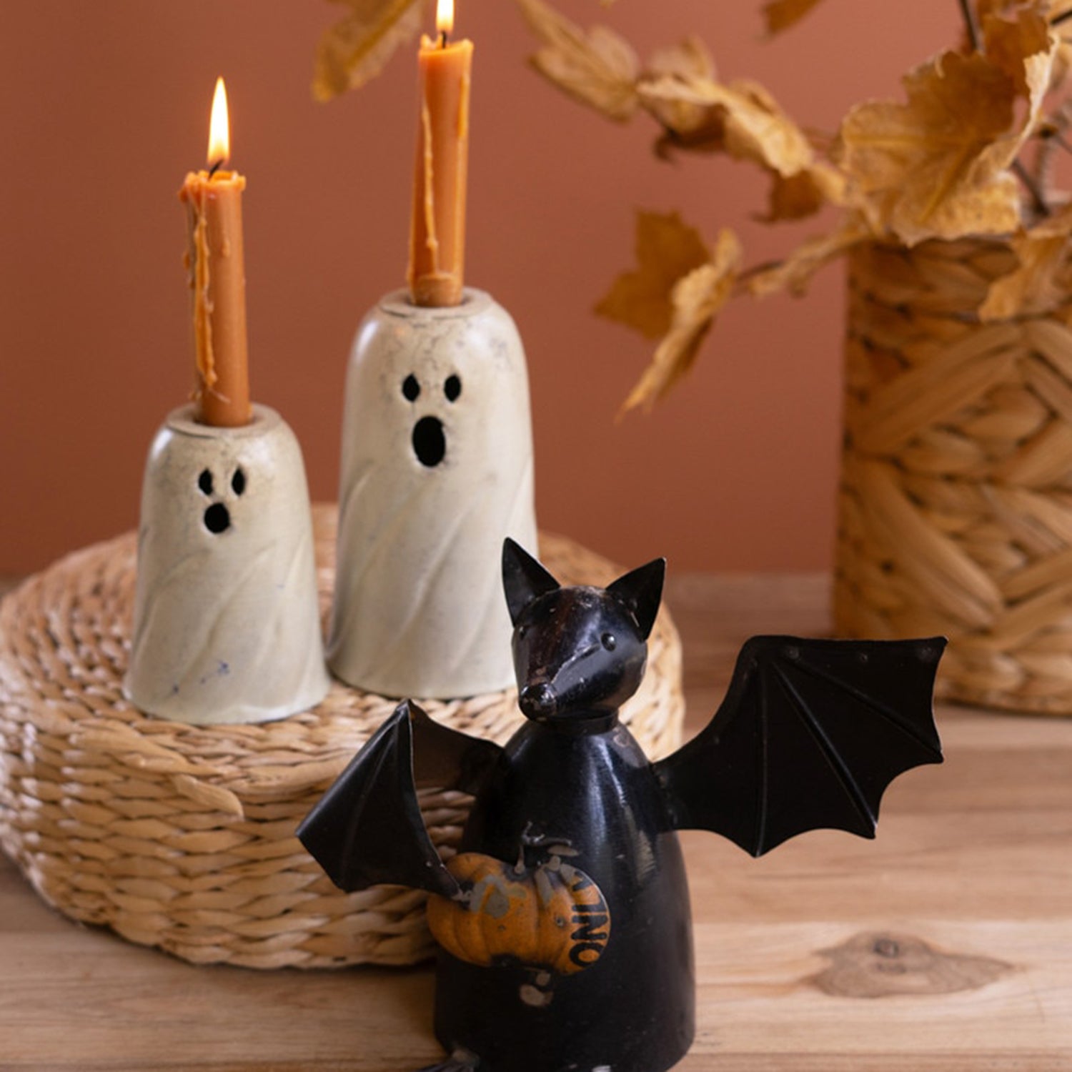 Recycled Metal Bat Holding a Pumpkin