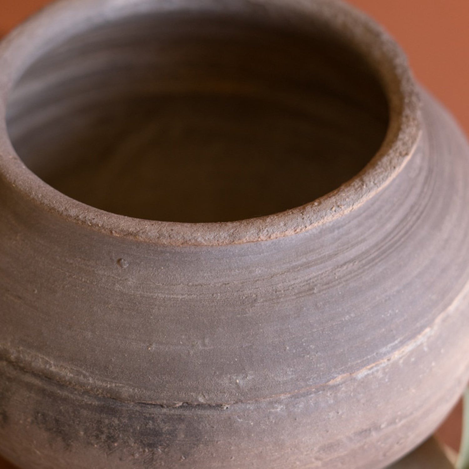 Black Clay Urn on an Iron Stand