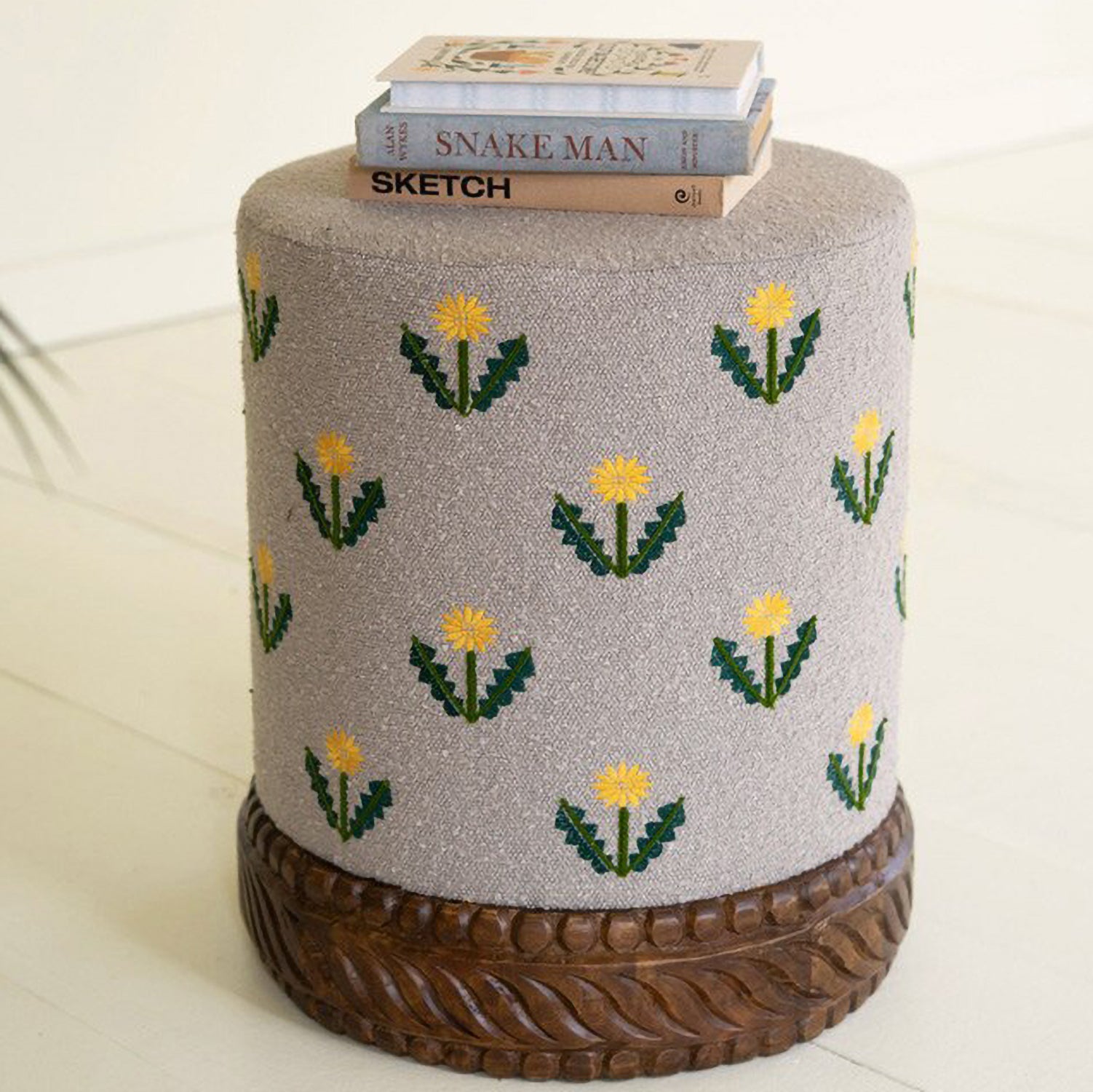 Upholstered Gray Ottoman with Embroidered Detail