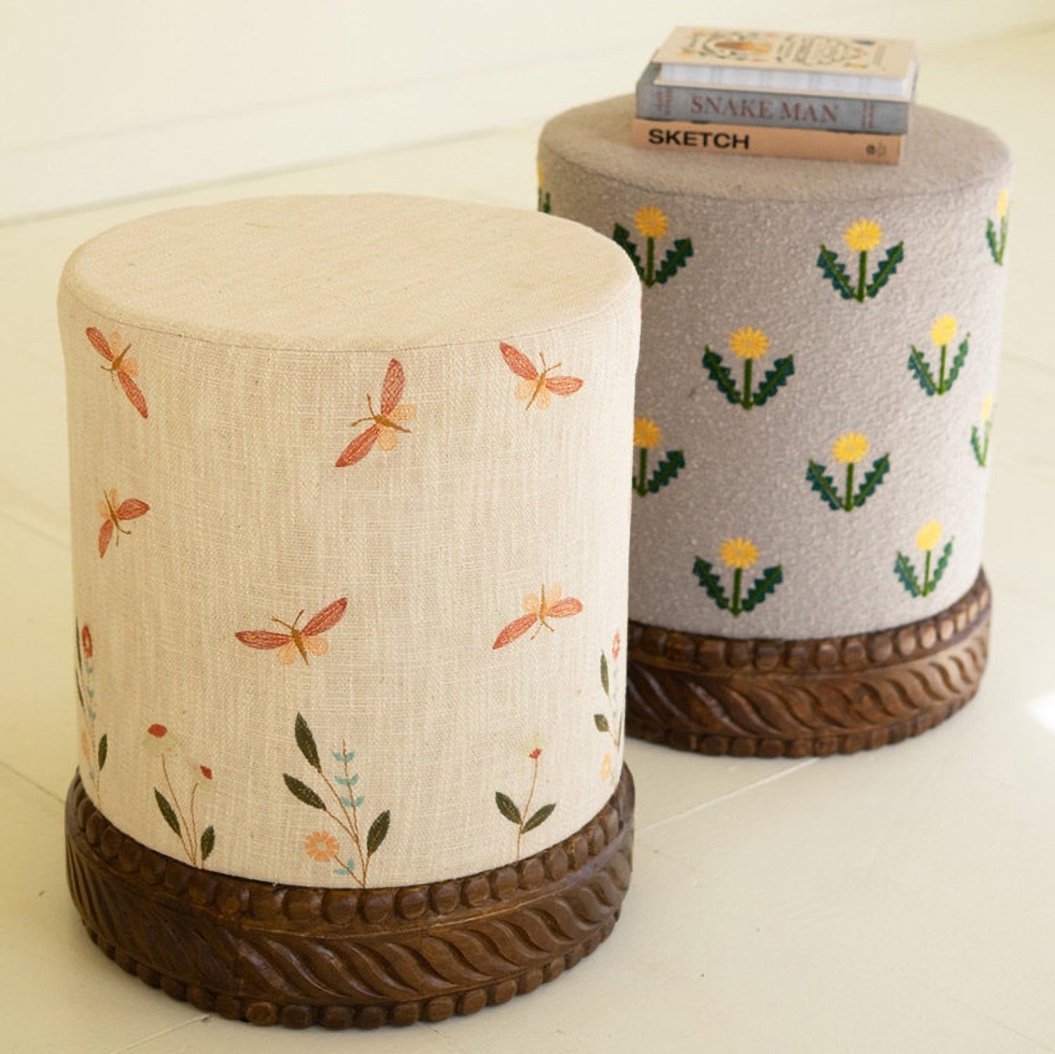 Upholstered Gray Ottoman with Embroidered Detail