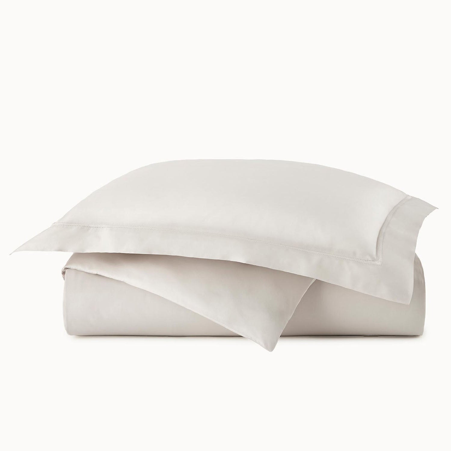 Peacock Alley Virtuoso Sateen Duvet Cover 600 thread count cotton sateen duvet cover, draped and layered detail on the bed