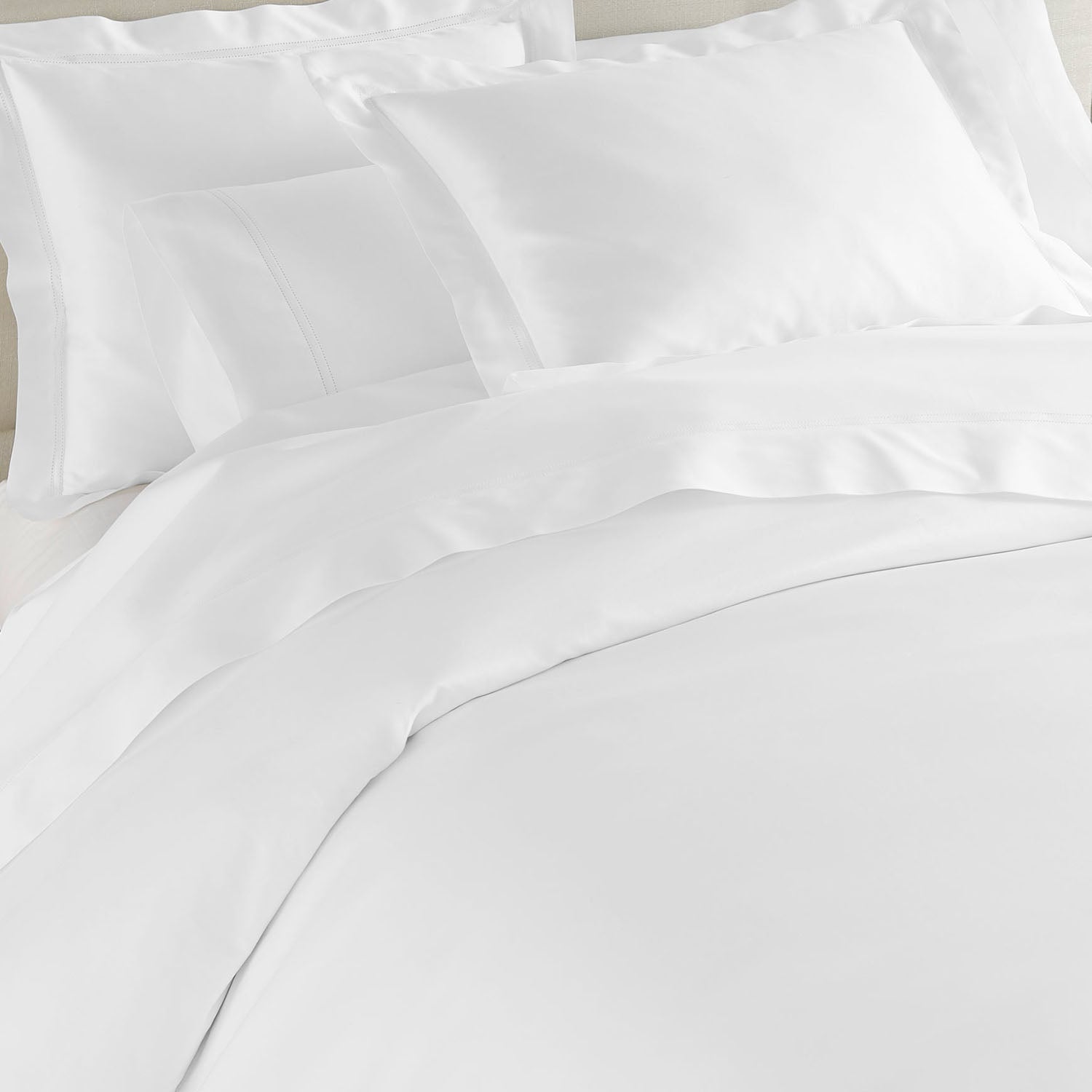 Virtuoso Sateen Duvet Cover 600 thread count cotton sateen duvet cover, styled with coordinating shams and pillows