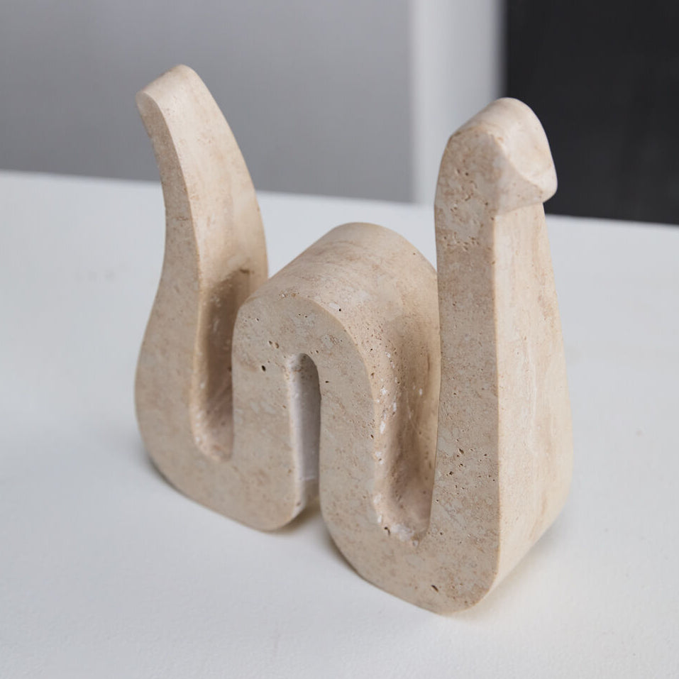 Kingsnake Sculpture detail view, tan travertine snake sculpture