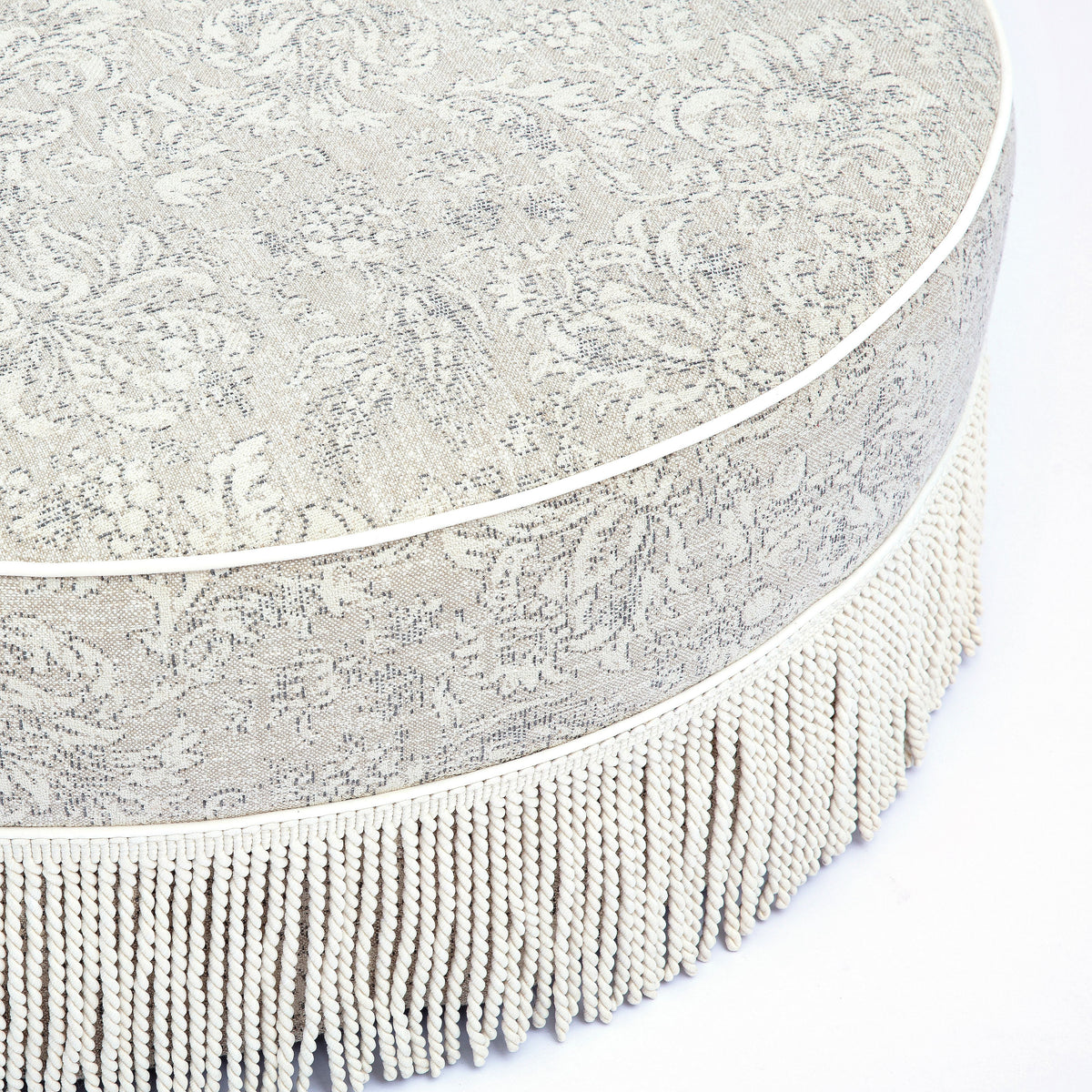 TOV Furniture Tassy Neutral Floral Tasseled Round Ottoman