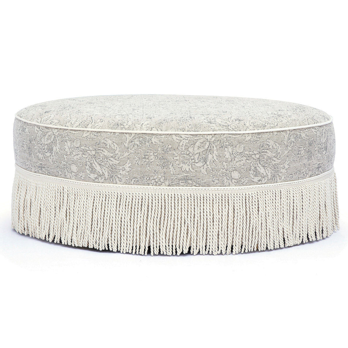 TOV Furniture Tassy Tasseled Round Ottoman in neutral floral jacquard, primary product view