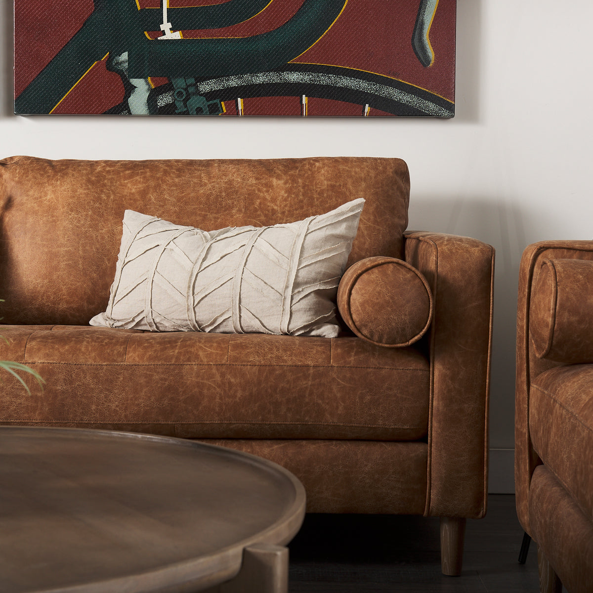 Mercana Loretta 88.0L x 36.2W x 33.9H Cognac Brown Faux Leather Three Seater Sofa with Two Bolster Cushions