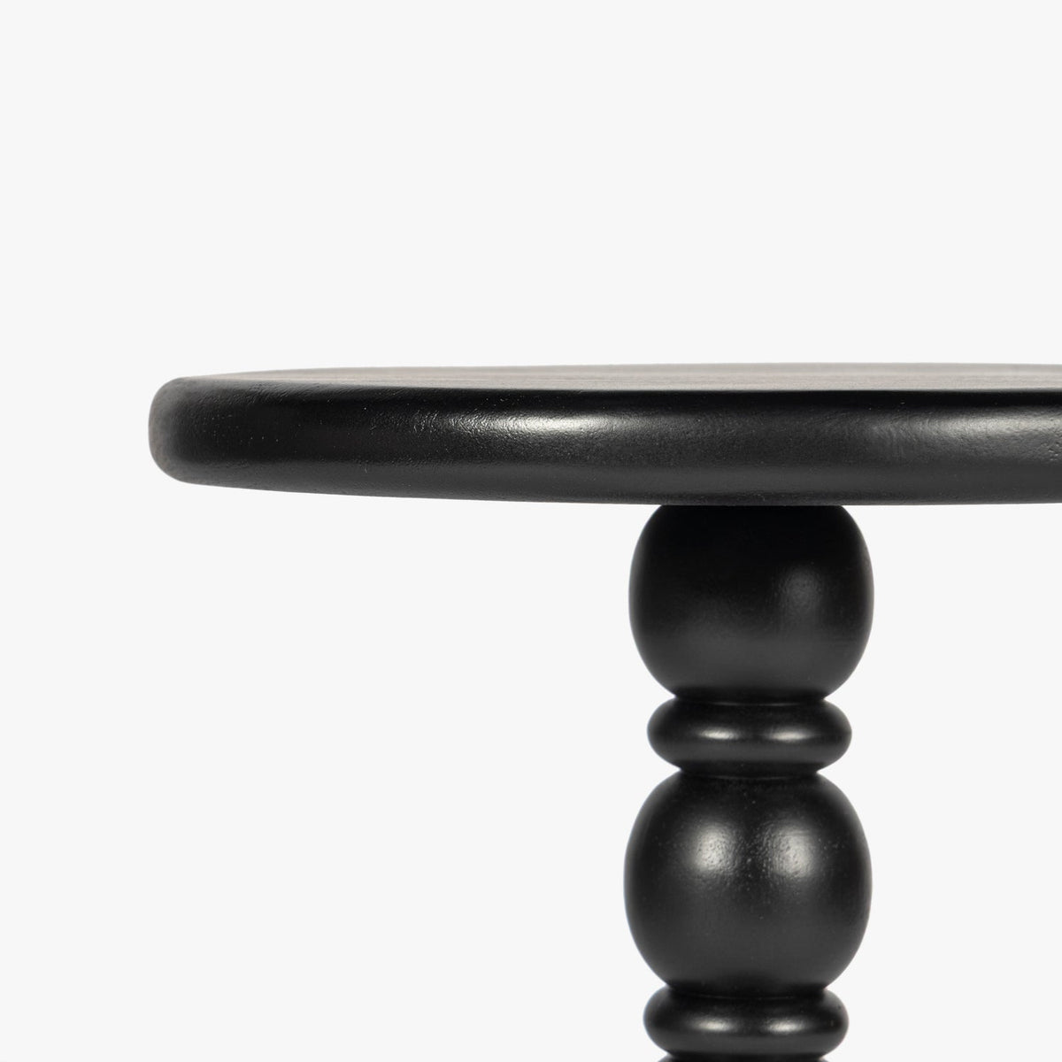 Close-up detail of the Co. House Designs Spindle Black Drink Table