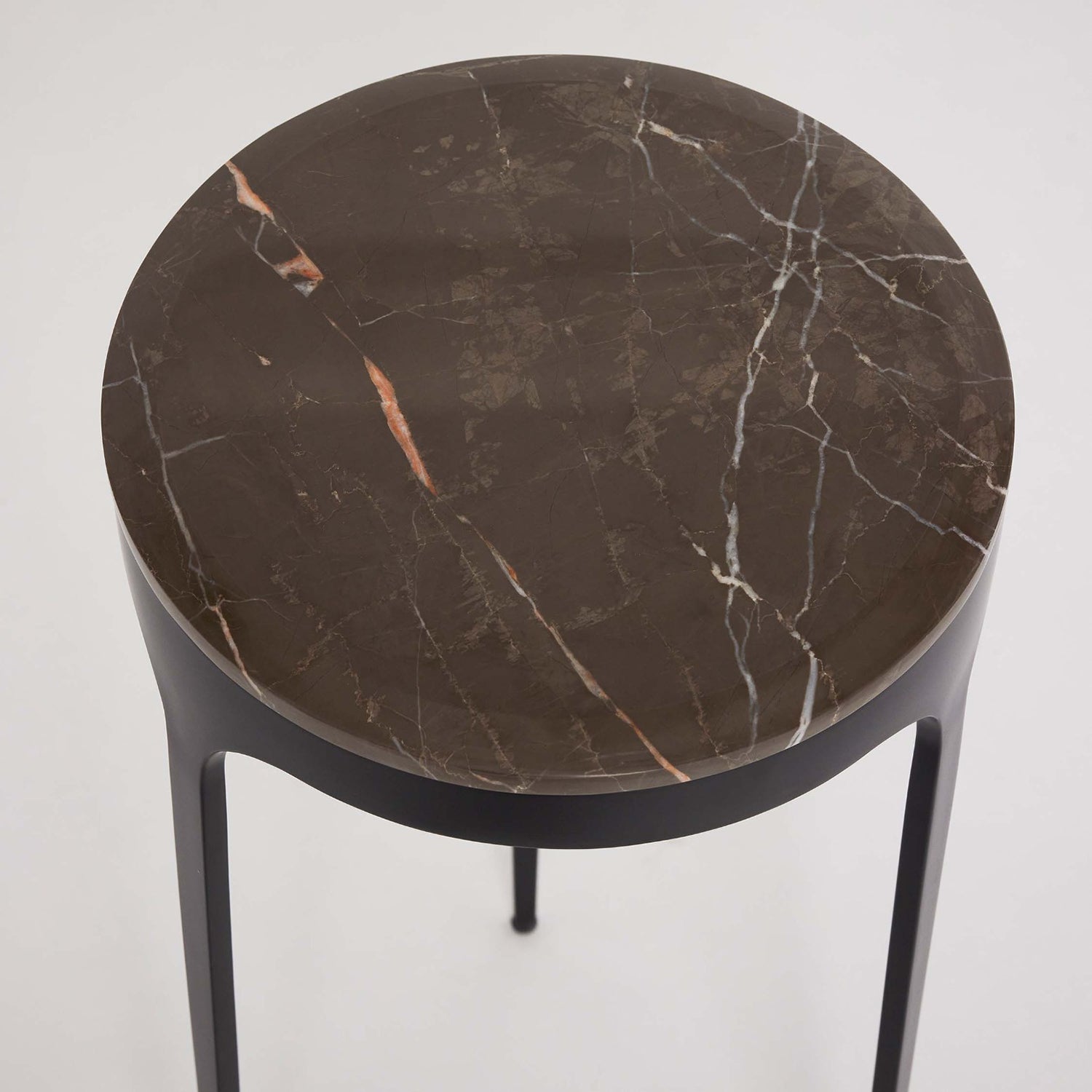 Detail of the tabletop on the Interlude Home Camilla Terra Brown Drink Table