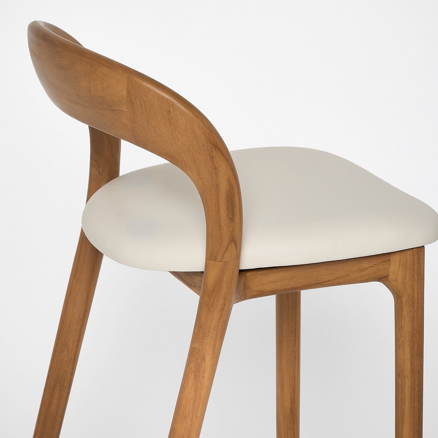 Close-up of the Teak finish on the Interlude Home Felix Tawny Counter Stool Set of 2