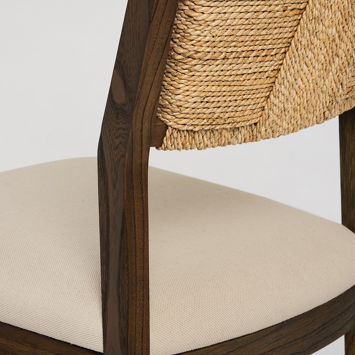 Close-up of the oak finish on the Interlude Home Colony Toffee Counter Stool