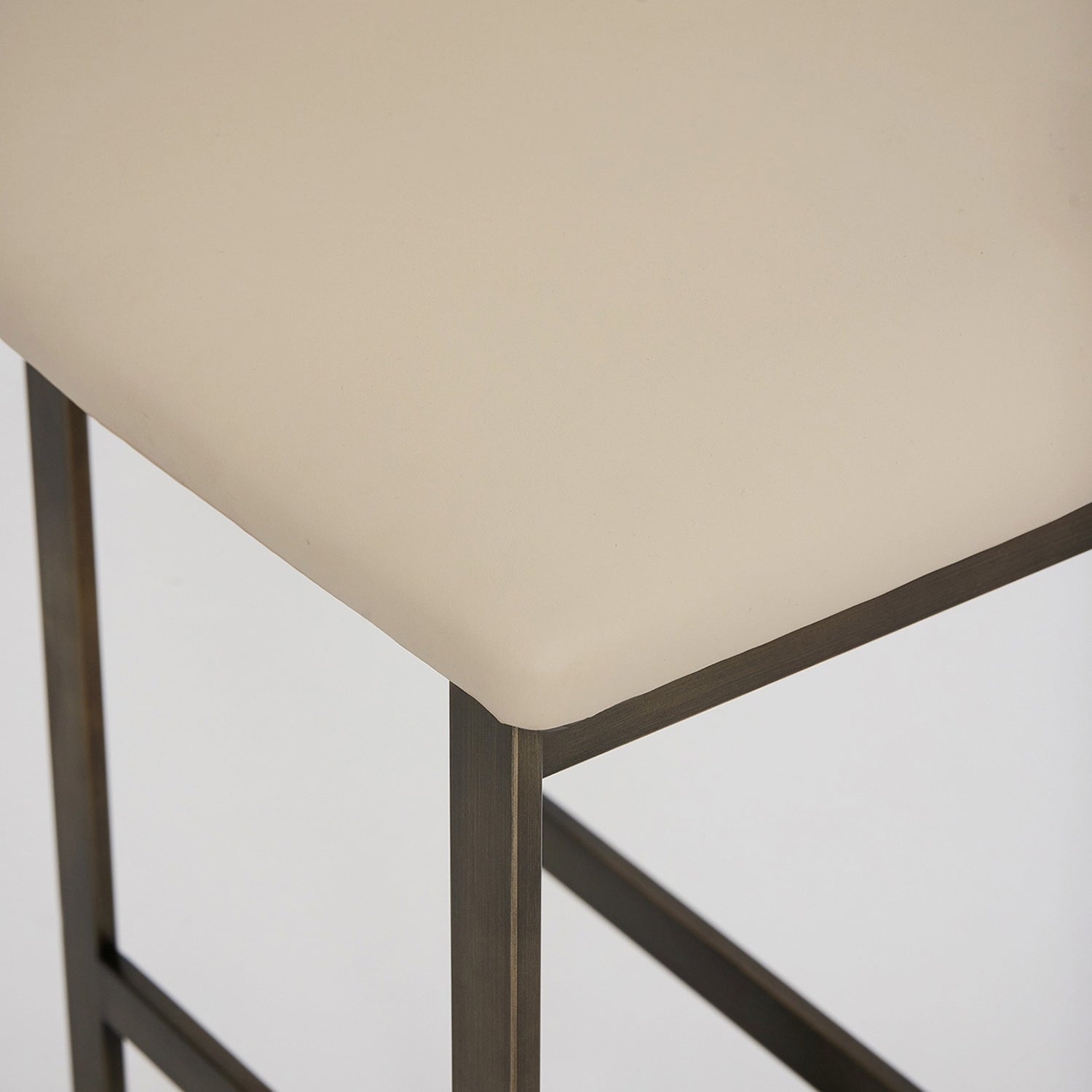 Landon II Antique Bronze Bar Stool in stainless steel Antique Bronze finish, close-up of the surface texture