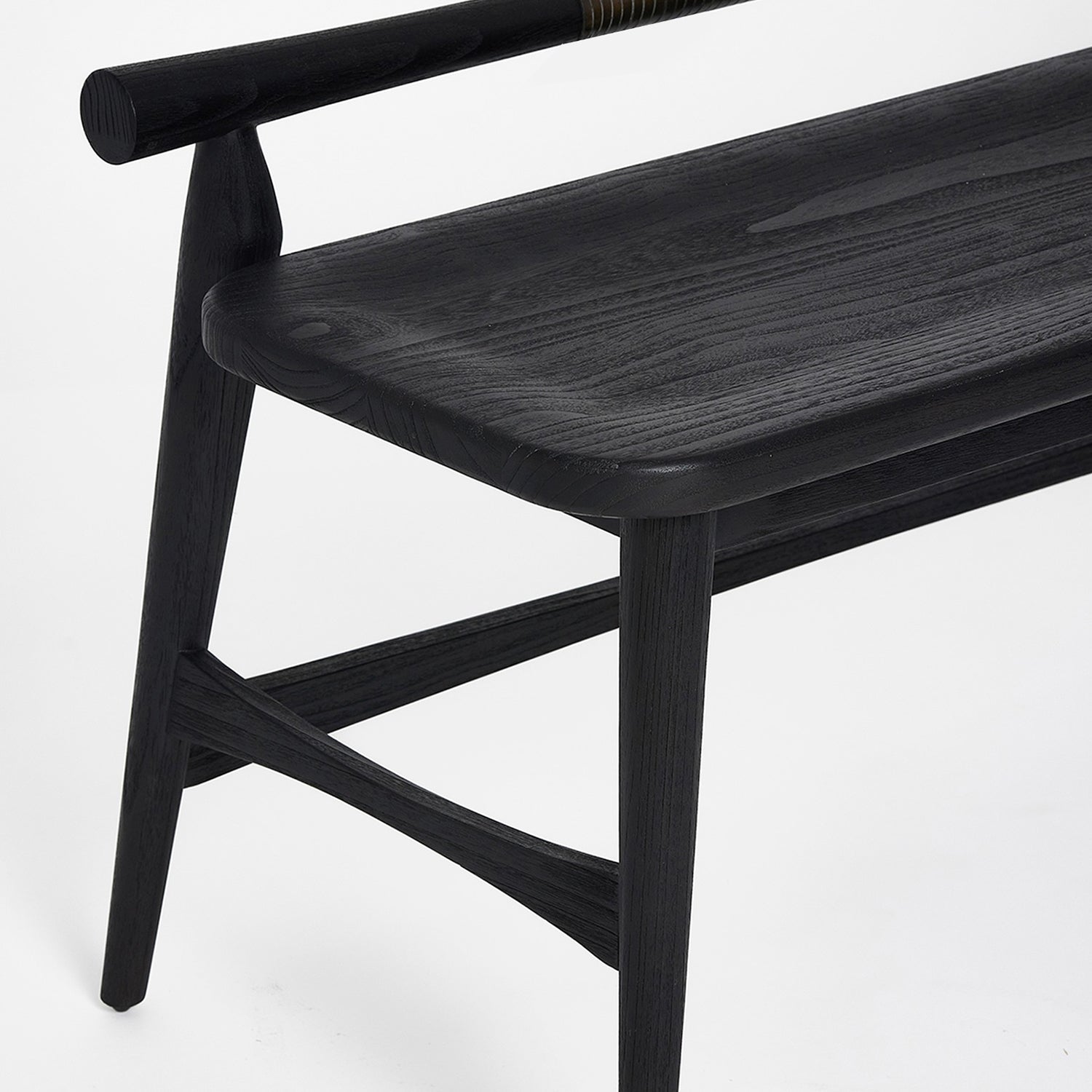 Detail of the cushion and frame on the Interlude Home Madeira Matte Black Bench