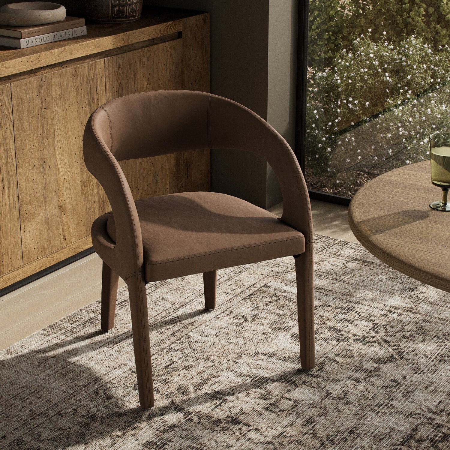Four Hands Hawkins Maestro Cigar Dining Chair styled in a room setting