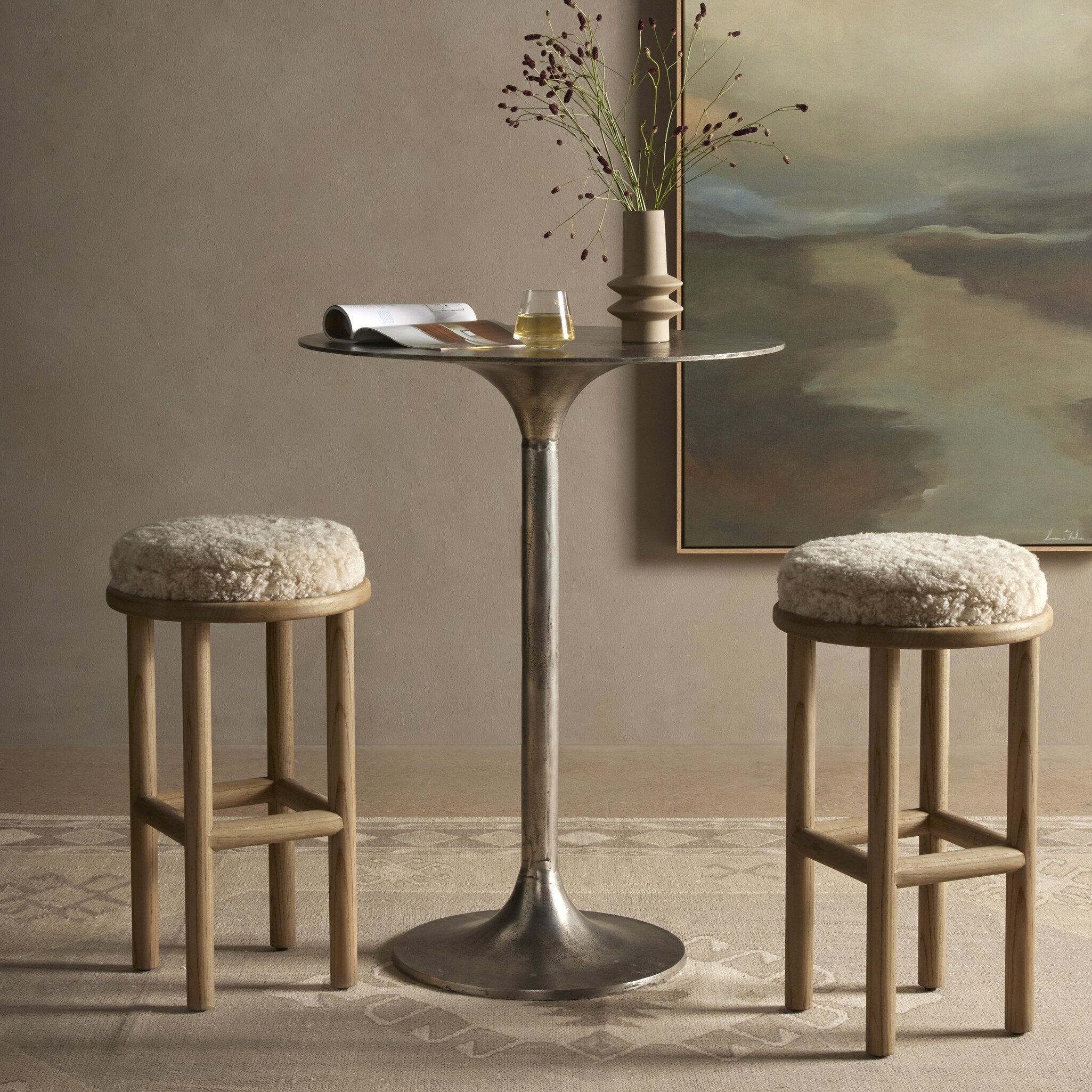 Four Hands Saldino Beige Shearling Counter Stool styled in a room setting