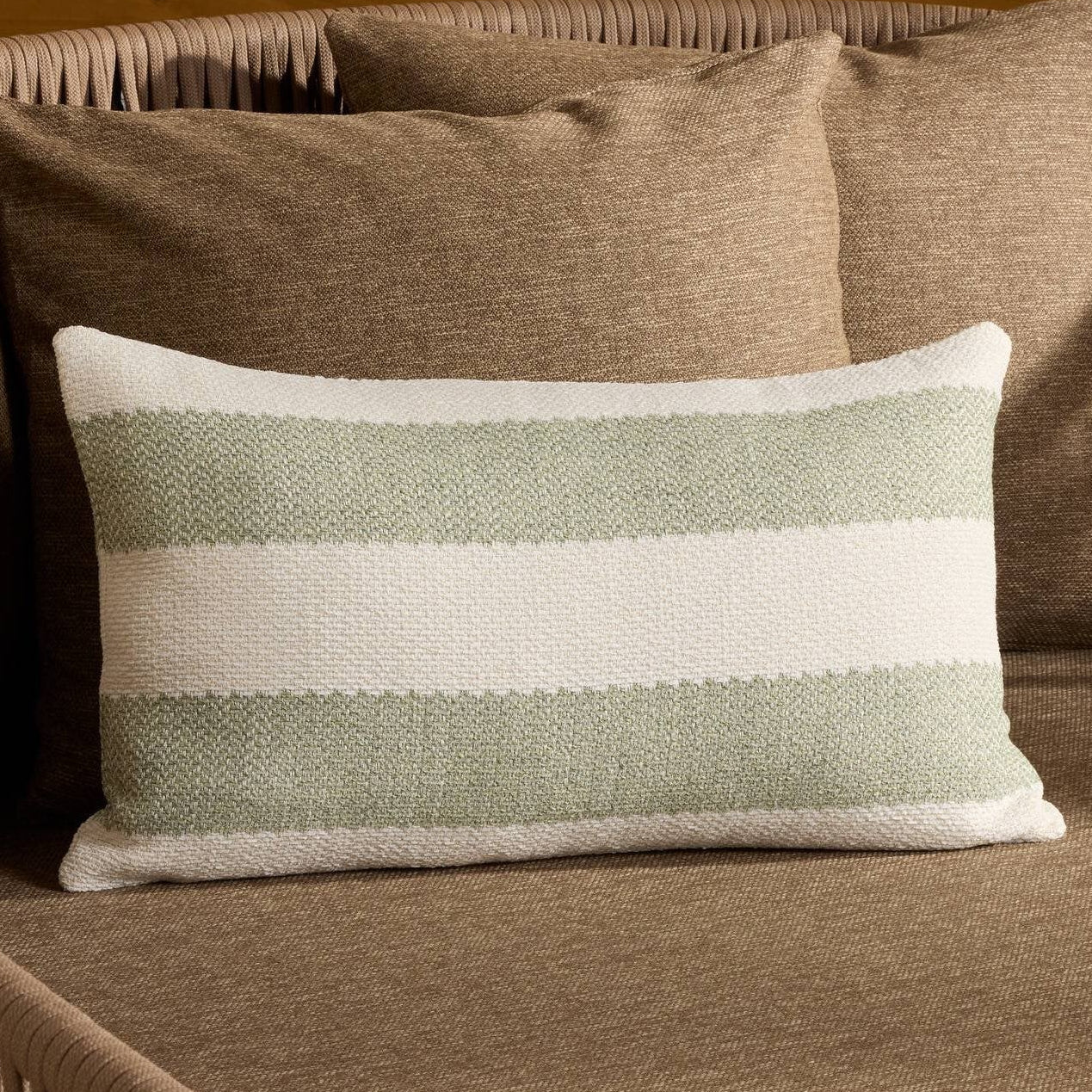 Four Hands Tarbett Stripe Tarbett Sage Outdoor Throw Pillow in a styled room setting