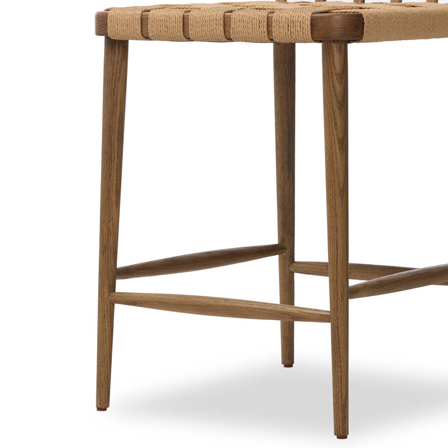 Four Hands Kershaw Counter Stool in smoked oak with rush woven seat, close-up detail of spindle back and rush seat, view 5