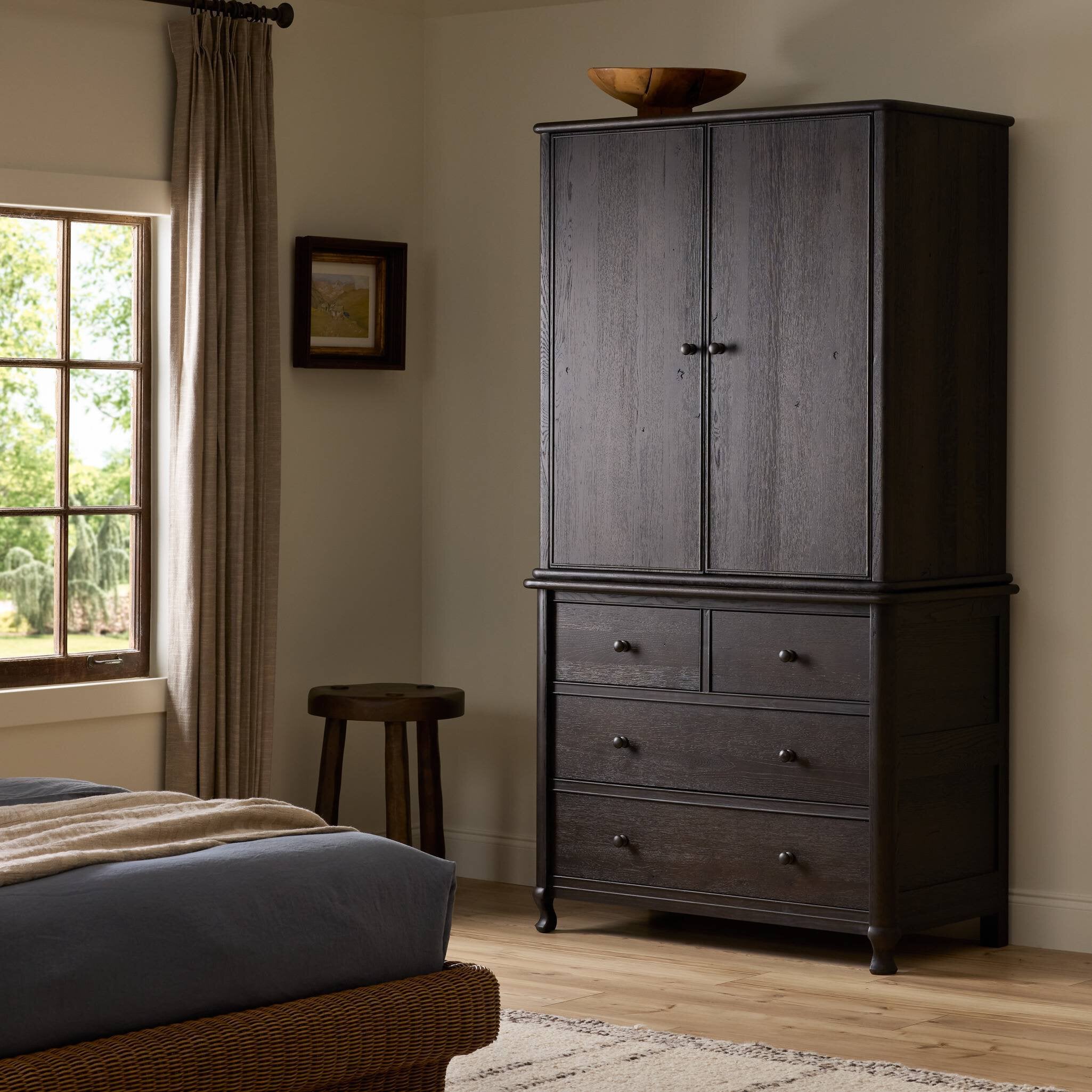 Four Hands Pika Smoked Black Oak Armoire styled room setting