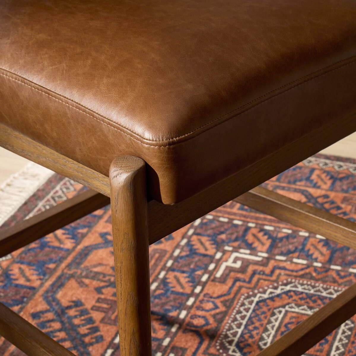 Four Hands Jazelle Havana Brown Bar Stool with leather and shearling, close-up detail of leather cylinder back