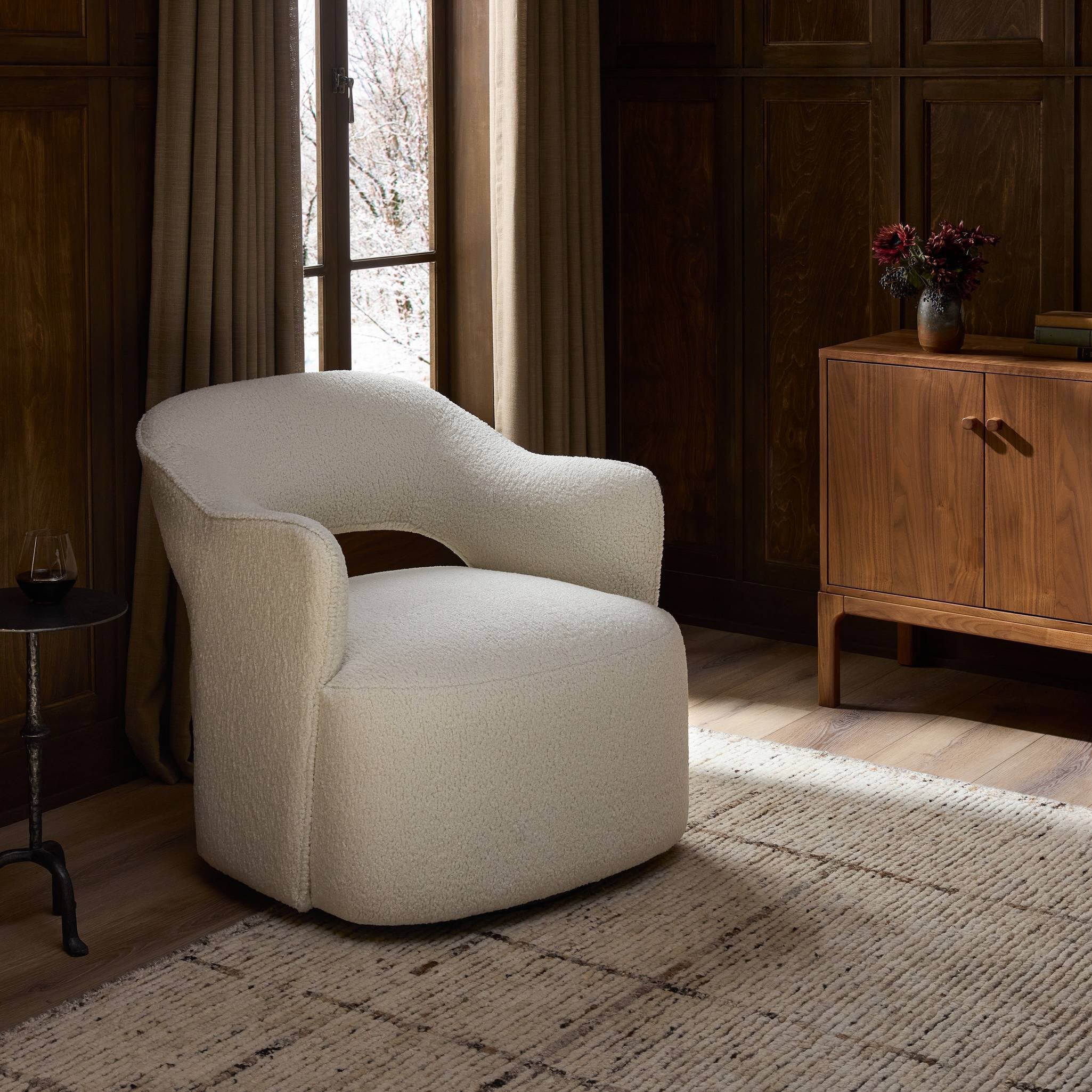 Four Hands Blythe Sheepskin Natural Swivel Chair styled room setting