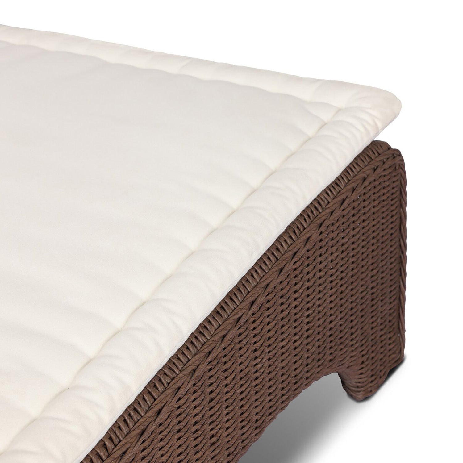 Four Hands Mazu Outdoor Chaise in tanned weave with salt cushion, close-up detail of woven base, view 6