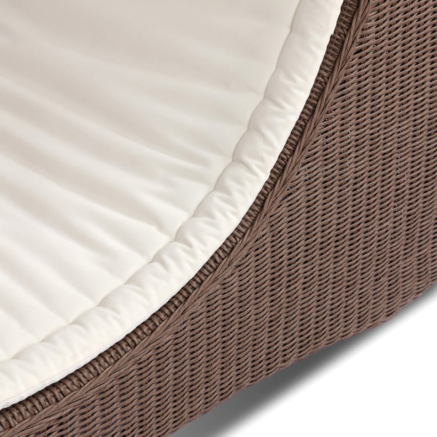Four Hands Mazu Outdoor Chaise in tanned weave with salt cushion, close-up detail of woven base, view 7
