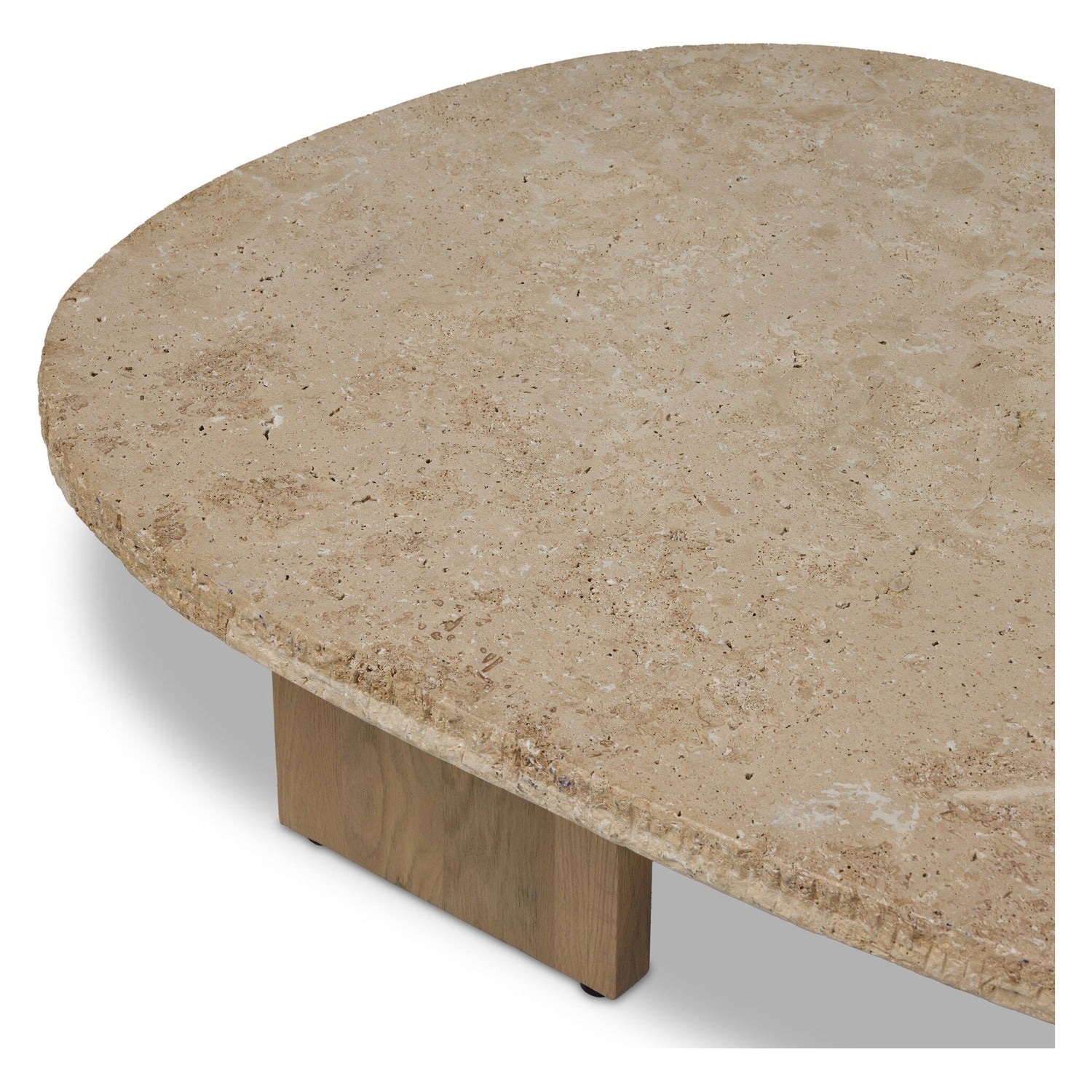 Four Hands Telma Chiseled Beige Lavastone Coffee Table with washed oak paddle legs, close-up detail of paddle leg and black steel bracket