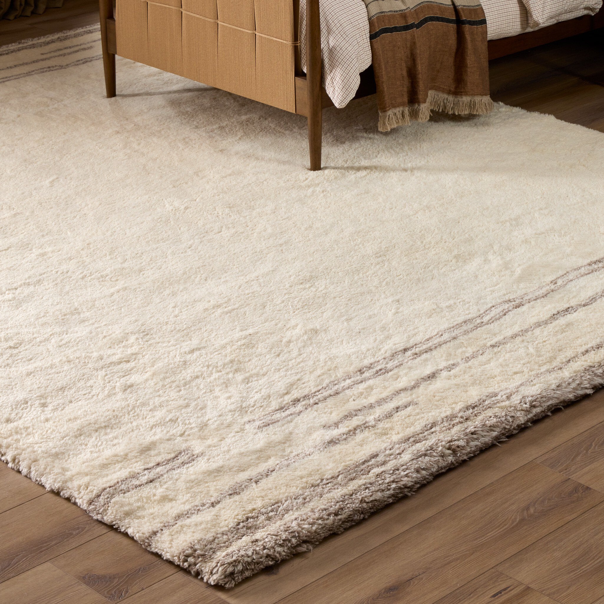 Four Hands Marbella Marbella Ivory Hand-Knotted Rug — in a styled room setting