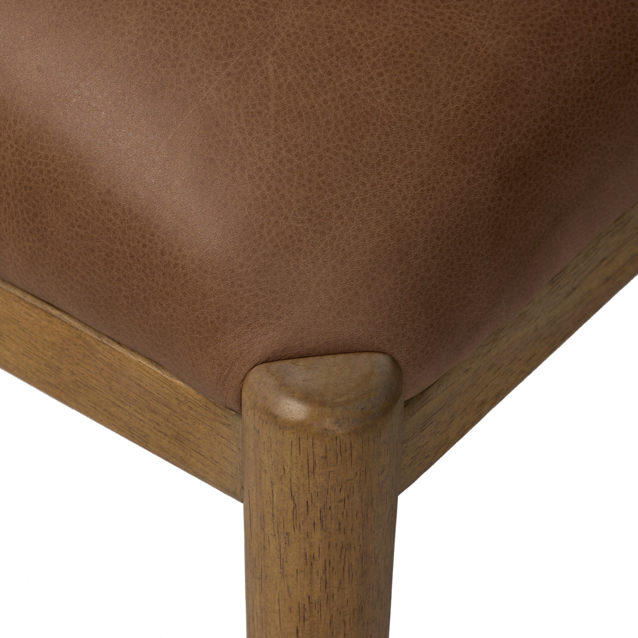Four Hands Gallagher Palermo Cigar Dining Chair in top-grain leather on drifted parawood, close-up detail of leather, view 5