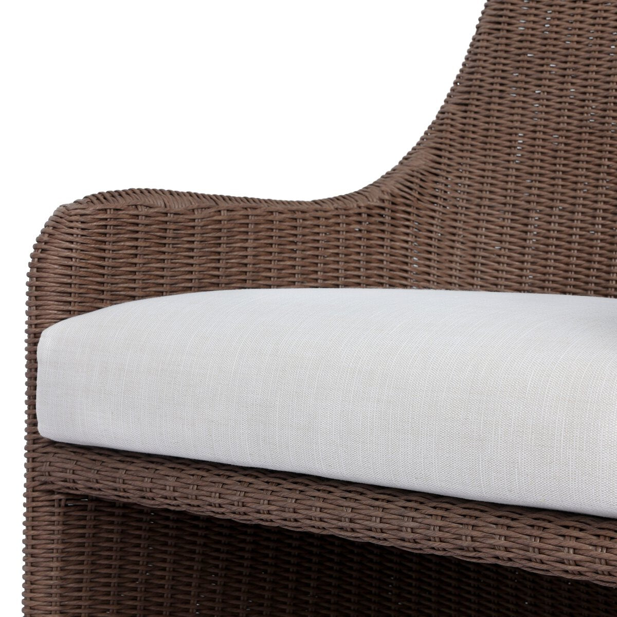Four Hands Blaire Outdoor Chair in tanned woven with cream cushion, close-up detail, view 3